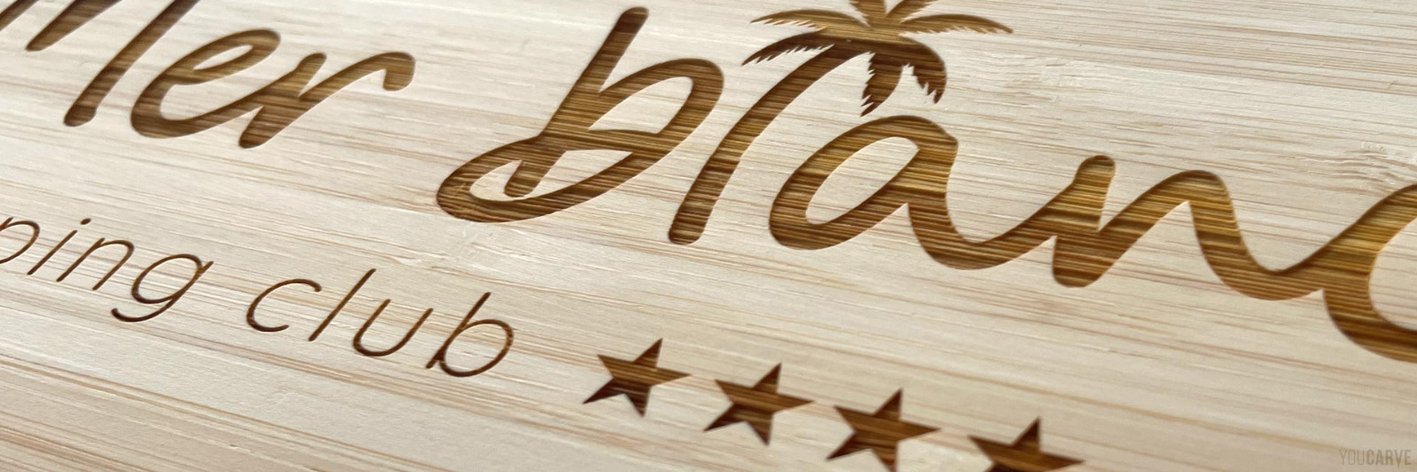 Laser marking-engraving on wood by Youcarve Close-up view of a laser engraving on natural bamboo